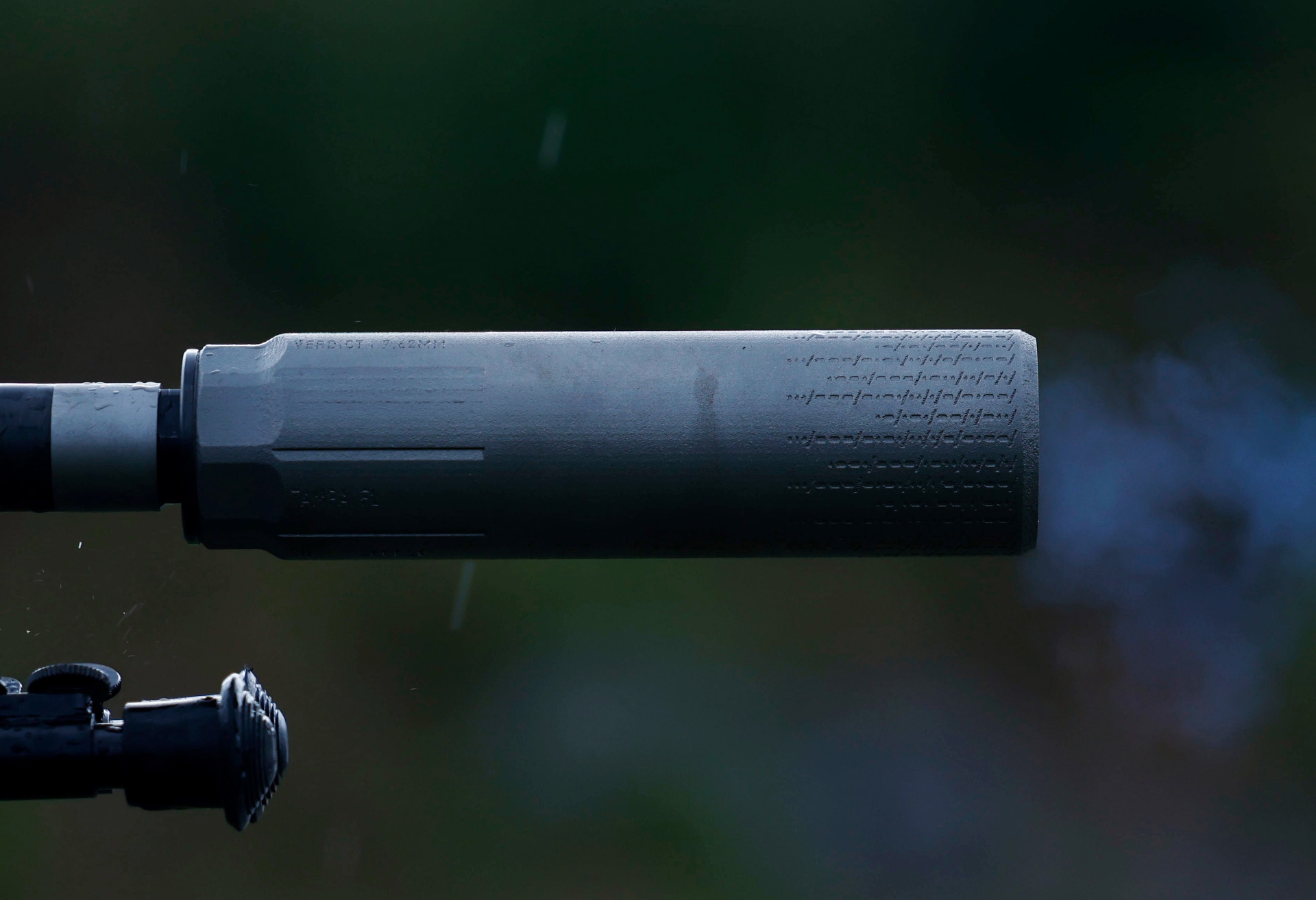Reduced backpressure and muzzle flash on a suppressed rifle